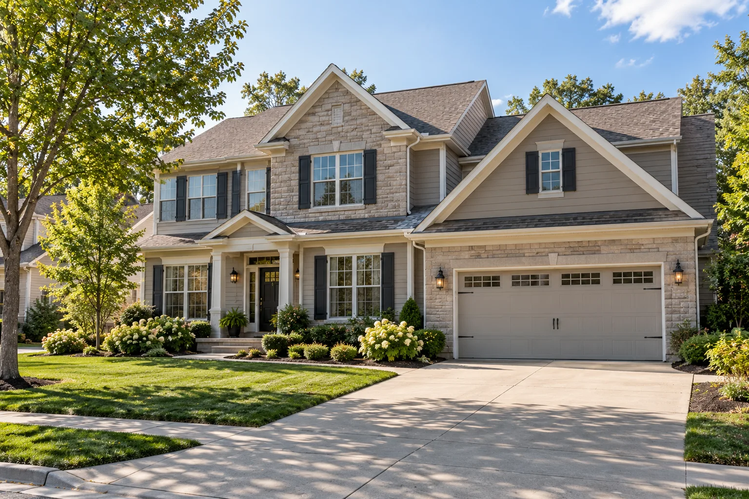 A newer two-story suburban home with stone accents and a two-car garage in a Midwestern subdivision